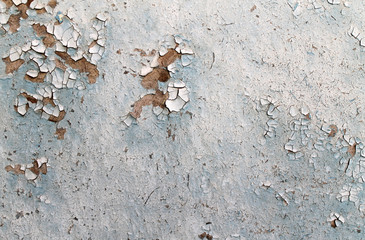 Old wooden background with remains of pieces of scraps of old paint on wood. Texture of an old tree, board with paint, vintage background peeling paint. old blue board with cracked paint