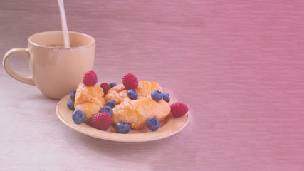 fresh juicy summer berries raspberry and blueberry with drops of honey in a natural beige cotton cloth. 