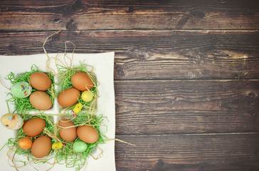 White dish with green grass and eggs and easter decorations