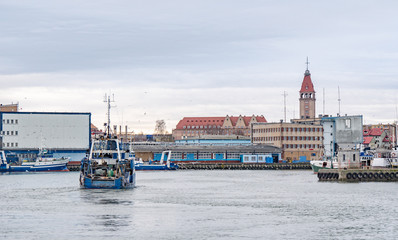 Obraz premium Fishing boat entering port Wladyslawowo in Poland