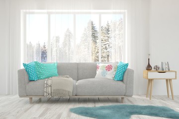 White stylish minimalist room with sofa and winter landscape in window. Scandinavian interior design. 3D illustration