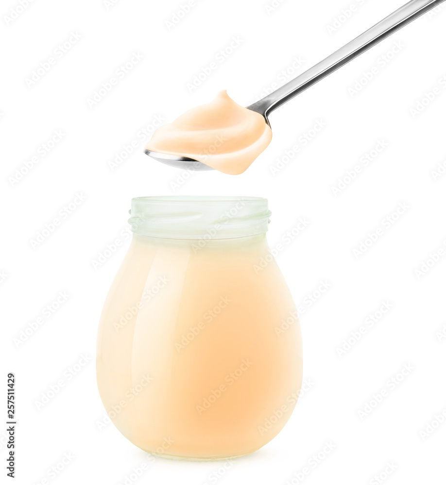 Aufkleber isolated peach yogurt. open glass jar and spoonful of fruit yoghurt isolated on white background wit