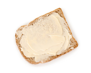 Fresh bread with butter on white background, top view