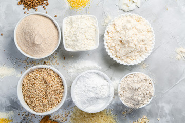 Gluten free concept - selection of alternative flours and ingredients, copy space