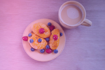 fresh juicy summer berries raspberry and blueberry with drops of honey in a natural beige cotton cloth. 