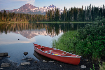 Red canoe by Scott Lake, Oregon, USA