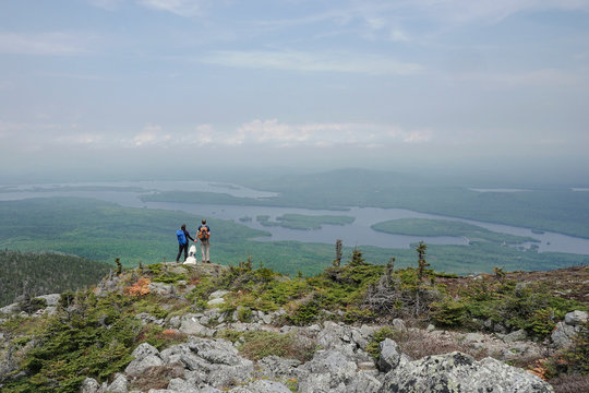 Rear view of couple hiking with dog on Avery Peak