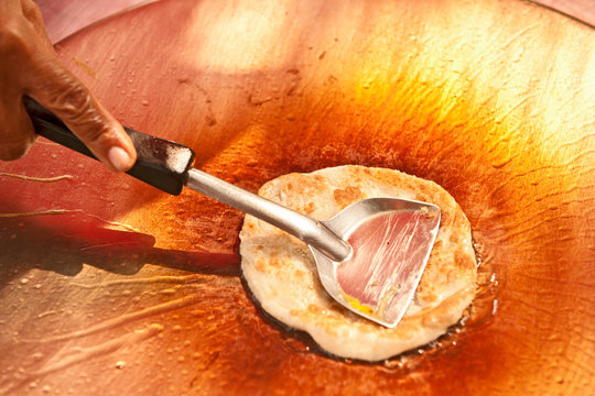 Traditional Thai pancake "Roti" in the making at a street vendor in Bangkok