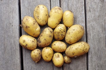 potatoes on wooden background