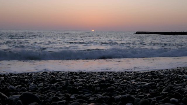 Sun set in sea. Sun hide to horizon in sea. One minute sunset process