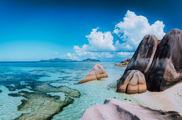 Bizarre huge granite rocks boulders at the famoust Anse Source d'Argent beach on island La Digue in...