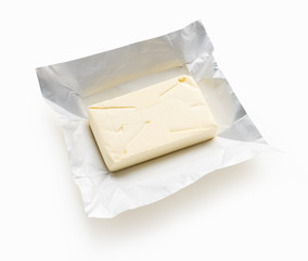 Piece of butter on a white background