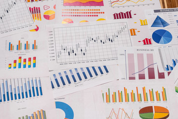 Different business graphs and diagrams used as background