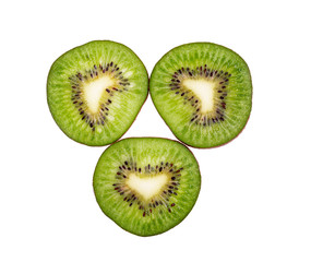 three slices of ripe kiwi on a white background