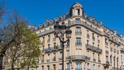 Paris, beautiful building in the Marais, typical parisian facade and windows rue Saint-Martin