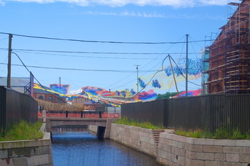 Image of old canal with decorations on the shore of New Holland island in St. Petersburg, Russia