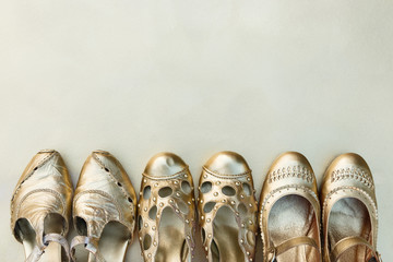 Old fashionable women shoes painted with gold paint. Capsule wardrobe, order in the closet, shoes...