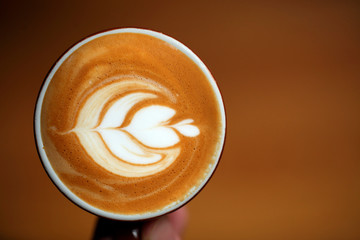 Close-up of coffee cup with pattern
