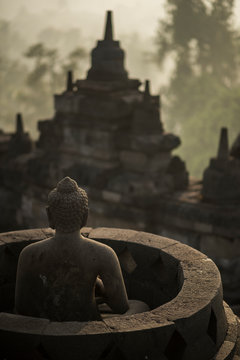 Buddha statue at the Borobudor temple in Java, Indonesia.