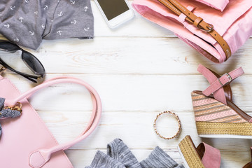Woman clothes and accessories in pink and gray colors