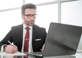 close up.businessman sitting at his Desk