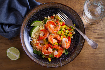 Shrimps with cauliflower, mango avocado, red paprika pepper and lime. overhead, horizontal