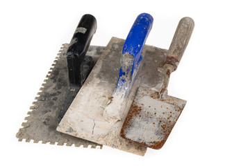 A dirty plastering plaster on a workshop table. Tools for construction workers.