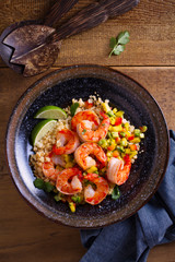 Shrimps with cauliflower, mango avocado, red paprika pepper and lime. overhead, vertical