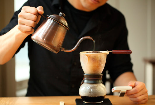 Man percolating coffee, Oakland, USA
