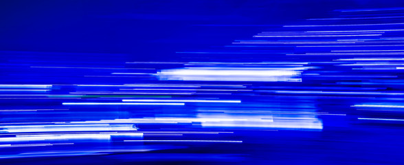 Abstract blue light trails on blue background
