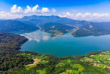 Fototapeta na wymiar Mountain Spring lake (Izvorul Muntelui), Romania. Aerial view from professional drone
