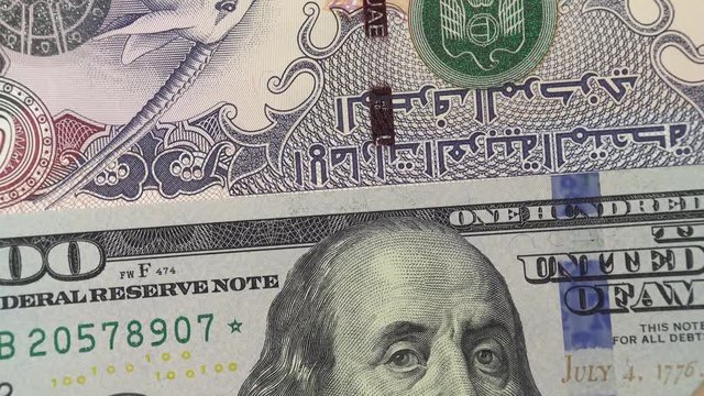 UAE dirham against US dollar bill rotating. United Arab Emirates and USA trade. 4K stock video footage