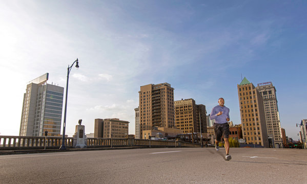 Man jogging on street in city, Birmingham, Alabama, USA