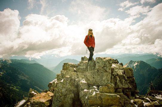 Man at summit of Pinnacle Peak,?Mt Rainier National Park, Washington State, USA