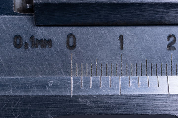 Vintage steel caliper tool closeup. Scale in focus. Tool in very good condition. Scale in metric...