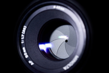 Lens aperture low light photo. Aperture blades is clean. Stock photo with blurred foreground....