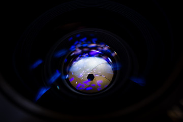 Lens aperture low light photo closeup. Blue traces on glass. Aperture blades is clean. Stock photo...