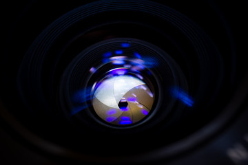 Lens aperture low light photo closeup. Blue traces on glass. Aperture blades is clean. Stock photo...