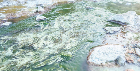 Hot spring river with sulfur limestone, natural Thailand onsen mineral water pond at Chae Son National Park