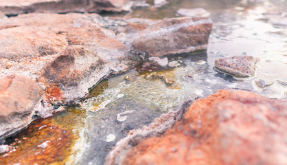 Hot spring river with sulfur limestone, natural Thailand onsen mineral water pond at Chae Son National Park