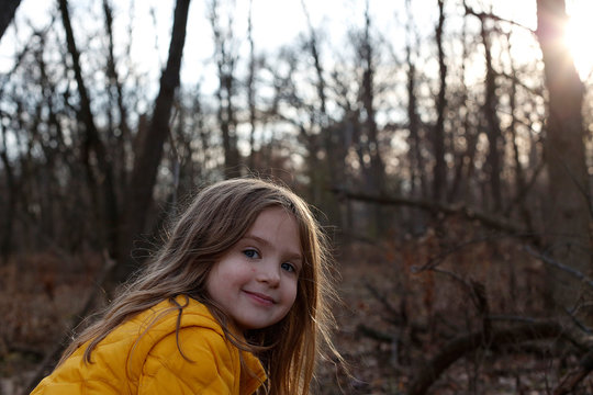 Smiling girl in forest