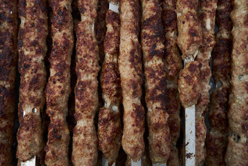 Shish kebab on a metal stick, top view. Lula kebab on skewers