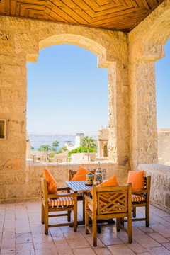 Table and chairs on covered terrace, Madaba Governorate, Jordan