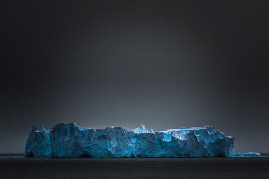 Iceberg under gray sky, Gerlache Strait, Antarctica
