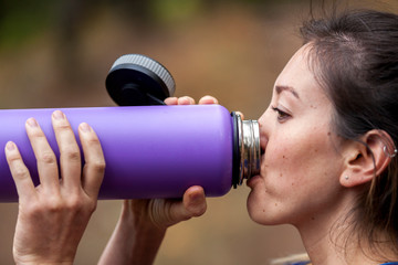 Woman drinking water from bottle