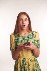 The portrait of an young blonde lady isolated over a white background