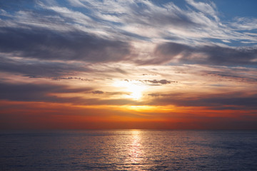 Naklejka na ściany i meble sunrise at ocean seascape with reflection