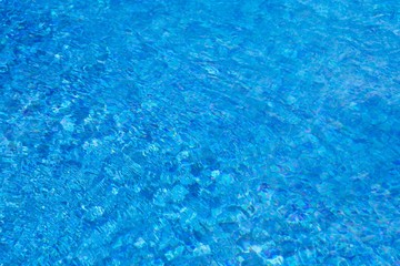 water ripples in swimming pool, blue background