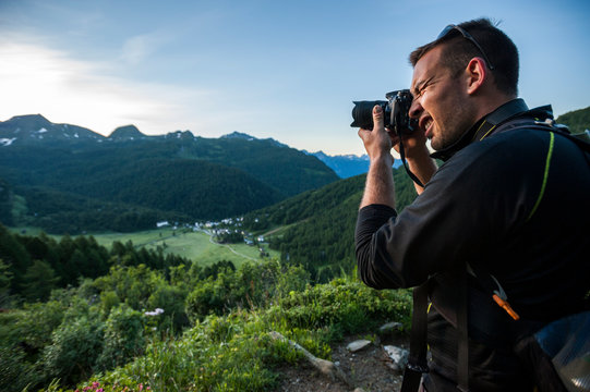 Photographer working at sunrise 