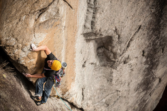 Man lead climbing a two pitches crack route in trad style, where only friends and nuts are allowed to protect the progression. Cadarese is a granite crag located in Premia, Ossola Valley, and is growing to one of the best european destination for trad and crack climbing.